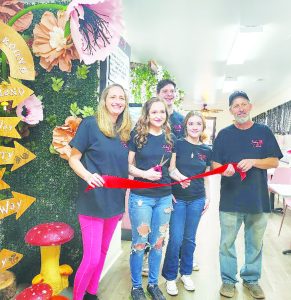 Baby Cakes celebrates their grand opening with a ribbon cutting.