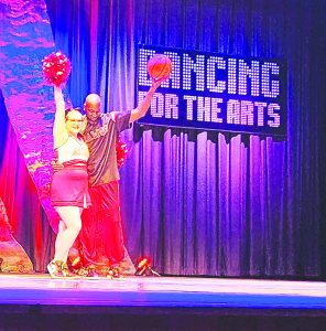 Anna Hatchett and Louis Cambell wearing Martinsville High School sports uniforms. 