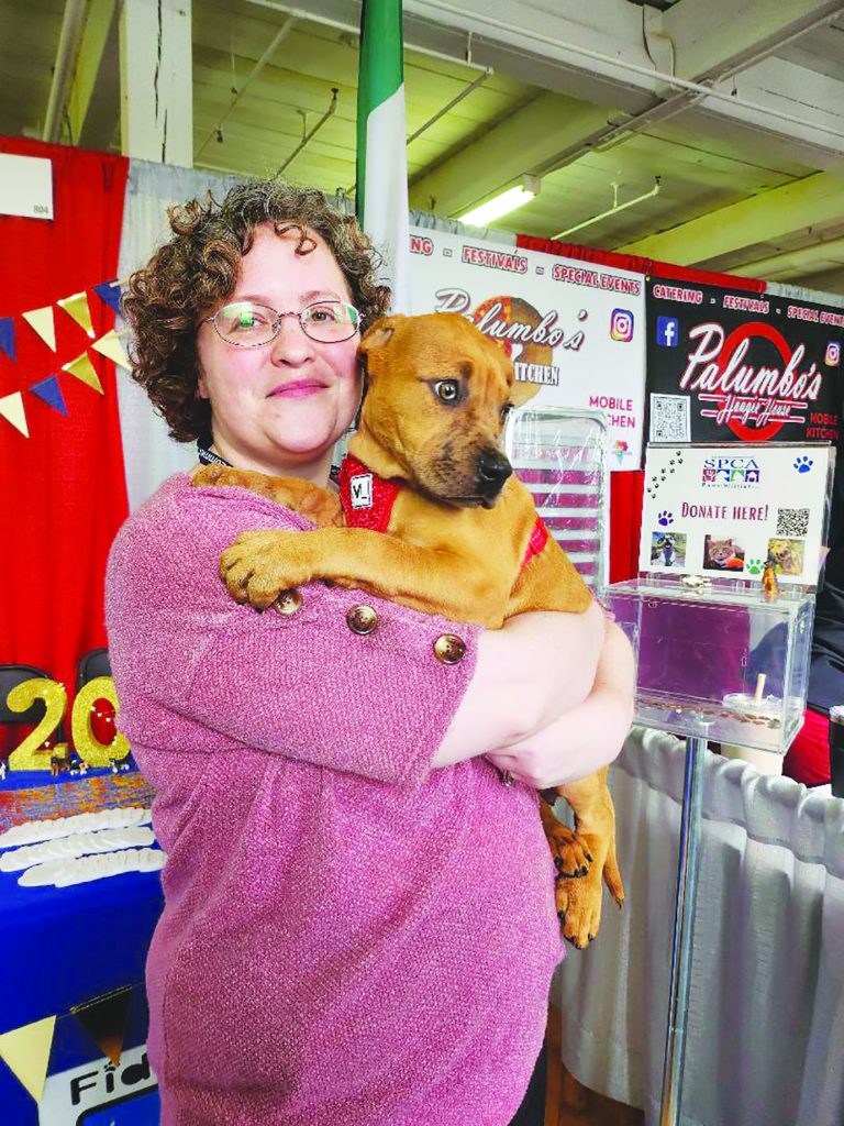 Catherine Gupton, executive director of the Martinsville Henry County SPCA, is pictured with Maple, one of the agency’s residents.