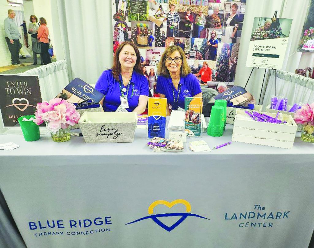 Lisa Martin (left) and Carol Wood (right) manned the Blue Ridge Therapy and Landmark Center booth. Both agencies are located in Patrick County.