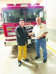 Patrick Henry Volunteer Fire Department Assistant Chief Tommy Hudson received a $500 check from the Stuart Rotary Club. The department serves both Henry and Patrick counties.