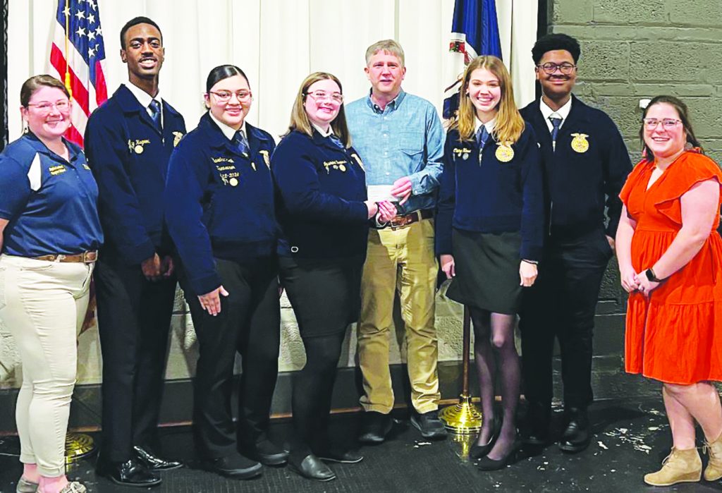 In March, the club made a donation to Bassett High School Future Farmers of America. Pictured are (left to right), FFA Advisor, Alysha Lawless; FFA Secretary, Garry Hagwood; FFA Treasurer, Phaedra Keith; FFA President, Jasmine Bowers; Bassett Kiwanis Club Representative, Jim Franklin; FFA Reporter, Claire Howe; FFA Sentinel, Javion Saunders and FFA Advisor, Caitlin Tatum.