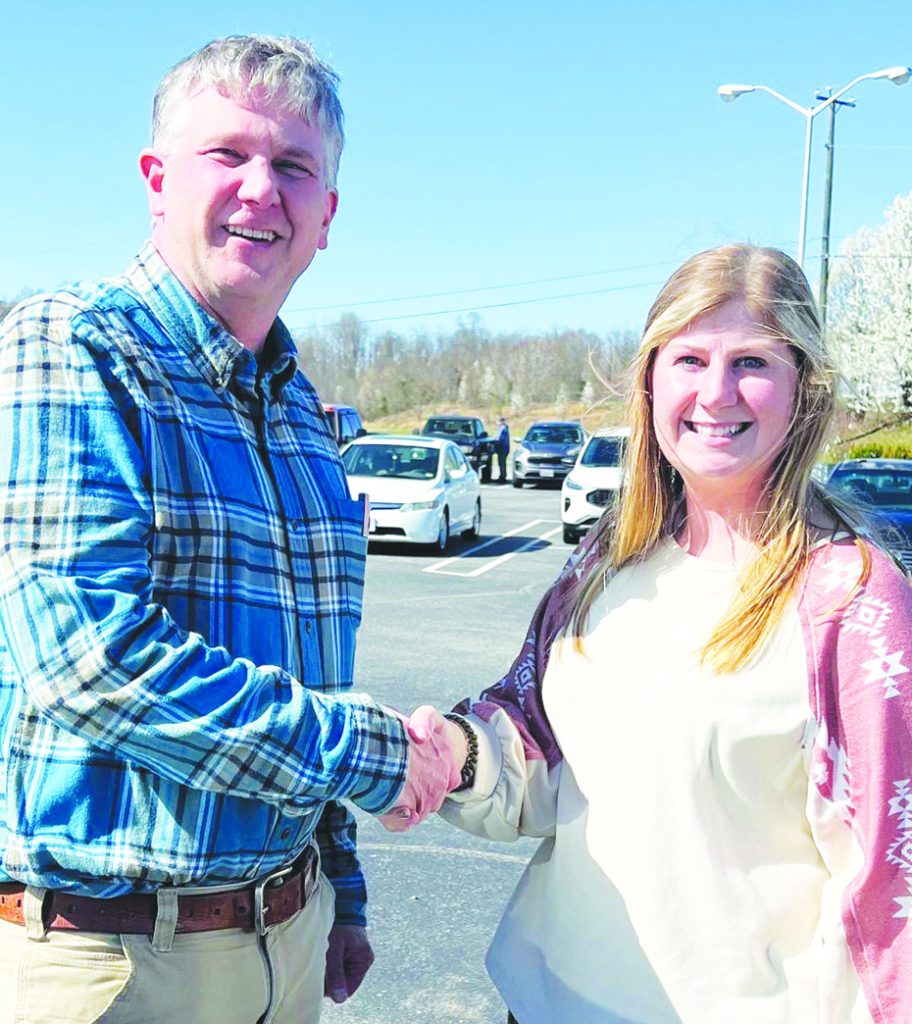 A representative from the Henry County Career Academy Future Farmers of America and a member of the Kiwanis Club are pictured. Kiwanis club representative Jim Franklin, left to right, and FFA advisor Brittany Brummitt