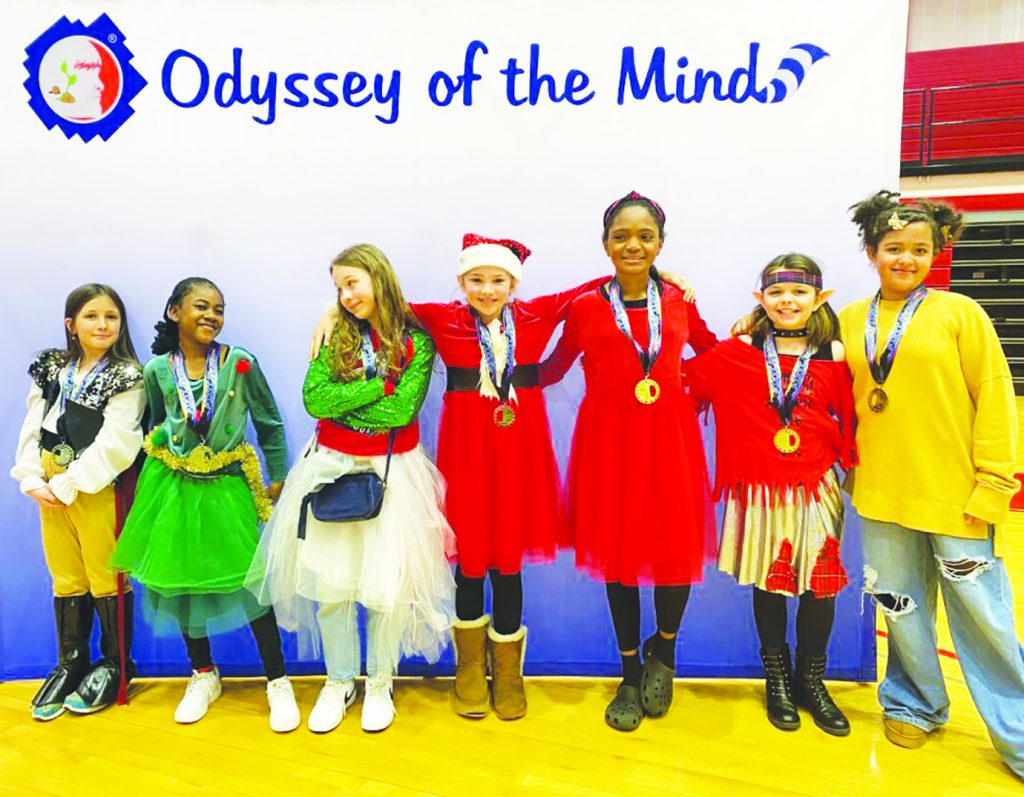 PHES students Mercy Moore, KeiYani Morrison, Katie Wall, Emery Taylor, Jade Holland Dallas, Adelaide Brent, and Hailey Turner pose with their first place medals at the regional Odyssey of the Mind competition.