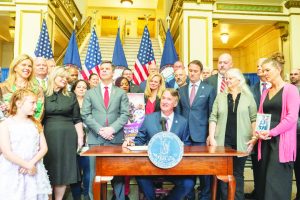 Gov. Glenn Youngkin participates in a bill signing ceremony at the Barbara Johns Building, April 4. 