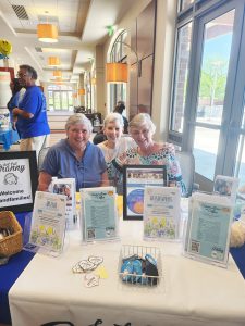 Teresa Setliff (left to right). Cindy Edwards, and Shirley Jones greet visitors to the Summer Resource Fair.