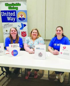 Members of the United Way manned the charity table.