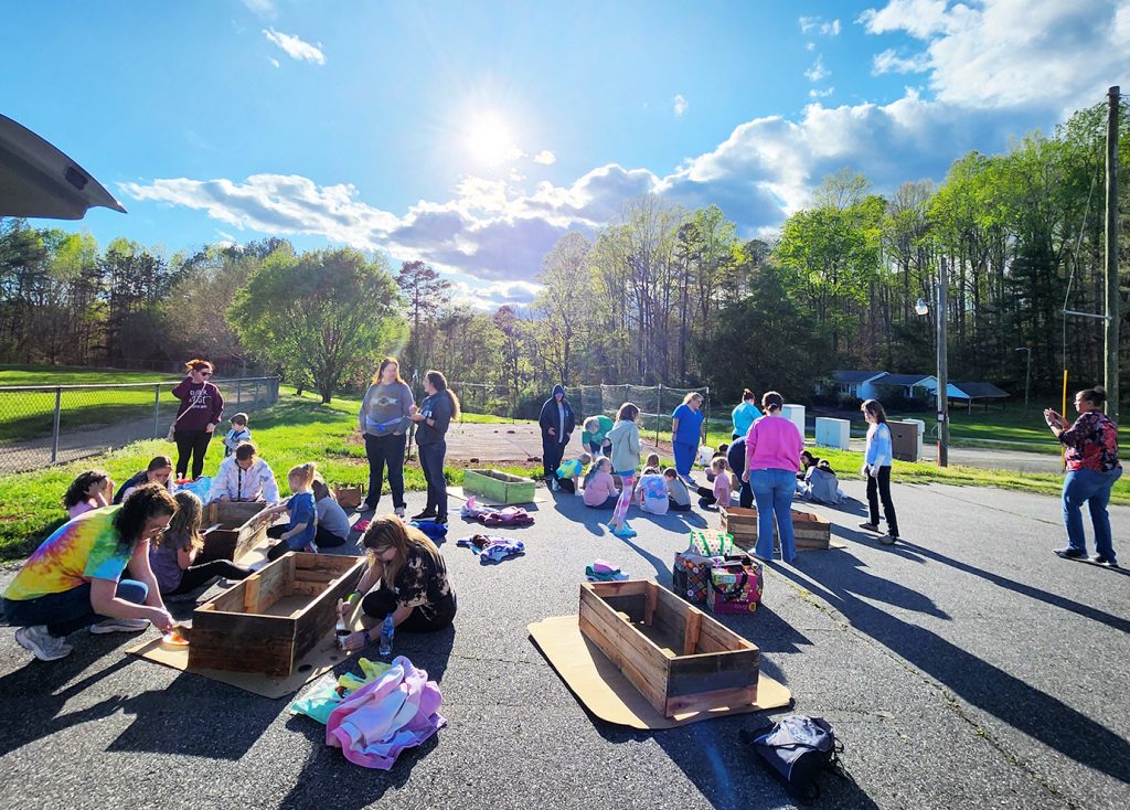 The Girl Scouts gathered at the Spencer-Penn Centre to prep the community garden’s raised flower beds.