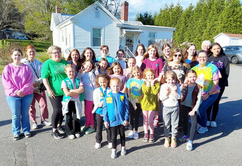 Girl Scouts stained and painted several boxes with unique designs.