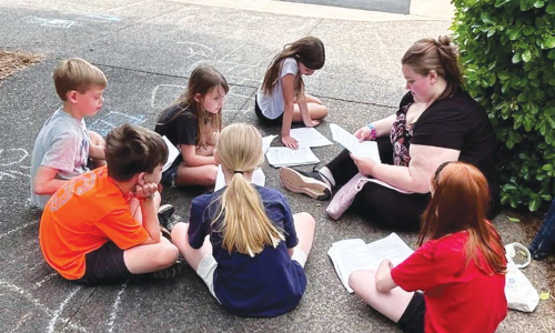 Students enjoy the sunshine and learning lines at Curtains Up! Theatre Camp.