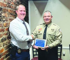 Henry County Sheriff’s Investigator Blayne Cassady received the Crime Stoppers Award from Sheriff Wayne Davis (right).