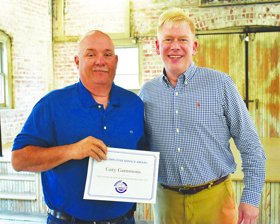 Gary Gammons (left) was recognized for 5 years of service. He is pictured with Roger Adams, director of Parks & Recreation.