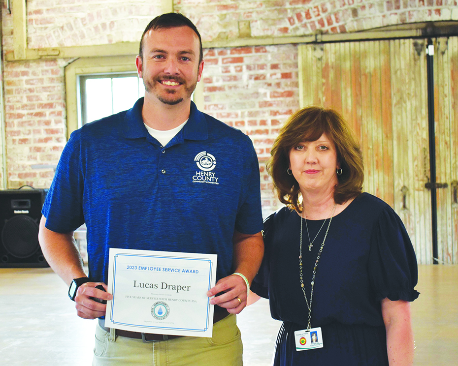 Lucas Draper, Safety Manager, was recognized for 5 years of service. He is pictured with Michelle Via, director of Human Resources.