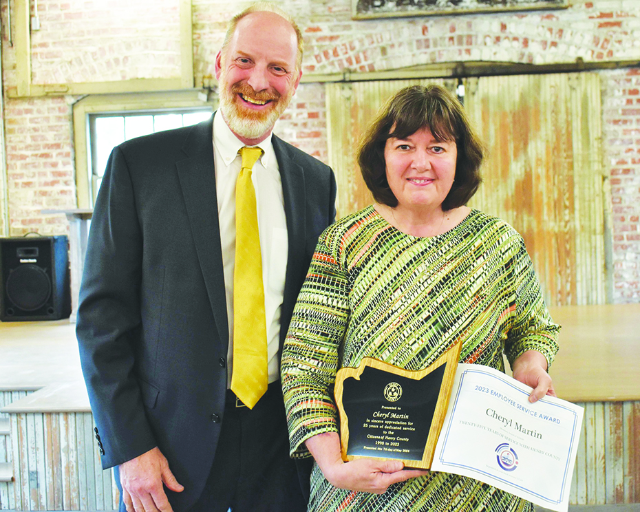 Cheryl Martin (right) was recognized for 25 years of service. She is pictured with Henry County Circuit Court Judge James R. McGarry.