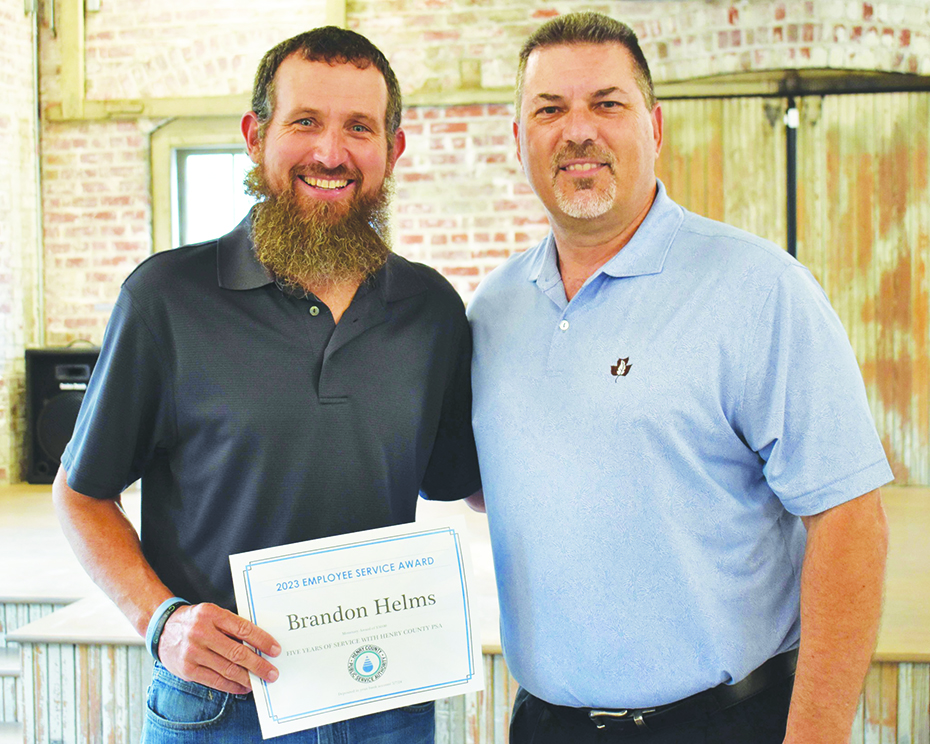 Brandon Helms was recognized for 5 years of service. He is pictured with Tim Pace, director of Engineering.