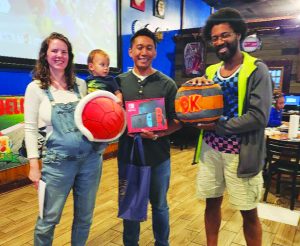 Tournament winners Jamie Marsigit, Dino Marsigit, and Nehemiah Edwards are pictured left to right. 