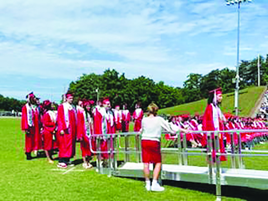 The Class of 2024 prepares to walk across the stage to receive their high school diplomas.