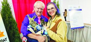 Laura and Rick Steere, owners of Infinity Acres Ranch, with a kangaroo. 