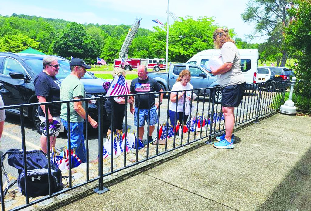 Families gathered flags to place on the graves of loved ones.