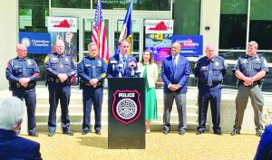 Martinsville Police Chief Fincher (second from left) and other law enforcement officials attended a recent press conference held by Virginia Attorney General Jason Miyares (at the podium) to discuss crime reduction in their respective locality and the positive impact of Operation Ceasefire Virginia, which adds additional prosecutors and focuses on arresting and prosecuting repeat offenders.