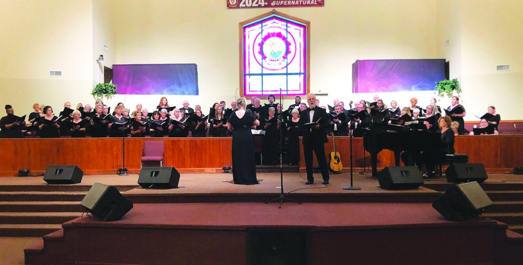 Jeff Stegall (in front) is the soloist as the Smith River Singers perform "When I Fall in Love." Pam Randall is directing, and Beth Chapman accompanies on piano. Smith River Singers is all volunteer, and membership is open. Sixty-five singers performed in this concert, “Love Is in the Air.”