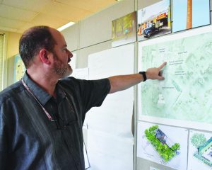 Lee Clark, Director of Planning, Zoning, and Inspections for Henry County, reviews a map detailing the revitalization of the Fieldale Recreation Center.