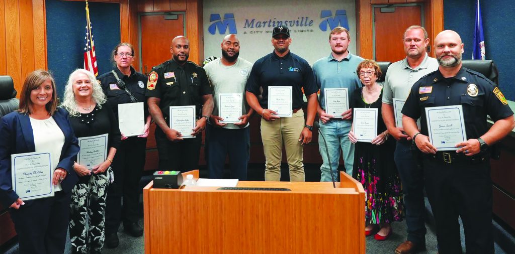 Employees also were honored individually by city officials and members of Martinsville City Council. Each is pictured, third from left, with City Manager Aretha Ferrell-Benavides, (left to right), Vice Mayor Aaron Rawls, Mayor LC Jones and council members Kathy Lawson and Lawrence Mitchell.