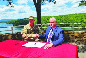 Col. Brad Morgan (left), Commander of the 57th District of the Army Corps of Engineers, shakes hands with Dale Wagoner, General Manager of the Henry County Public Service Authority (PSA), after signing a deal to provide the PSA with an additional 3-million gallons of water storage capacity at Philpott Lake.