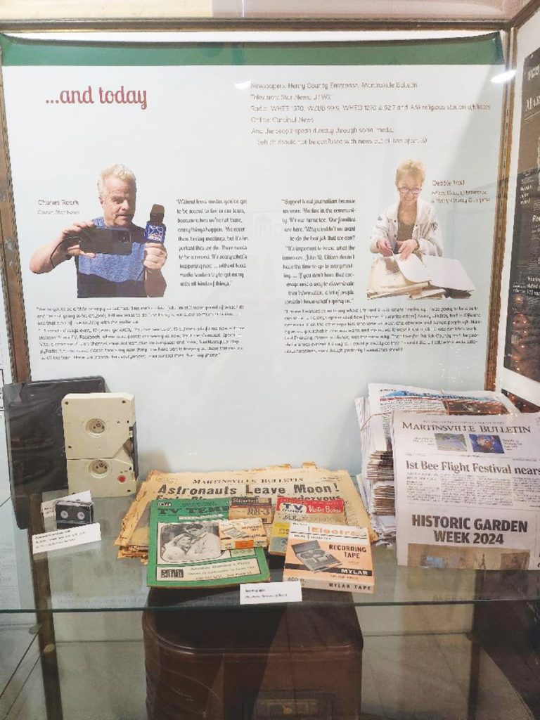 Modern-day media representatives Charles Roark, of Star News, and Debbie Hall, of The Enterprise and Henry County Enterprise, are featured in part of a new exhibit at the Martinsville Henry County Heritage Center & Museum called “Connected Community.” More than 70 people attended the opening.