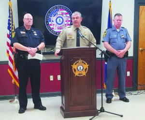 Henry County Sheriff Wayne Davis fielded questions about an officer involved shooting on Monday, June 17. He is flanked by Martinsville Police Chief Rob Fincher (left) and a Virginia 
State Trooper.
