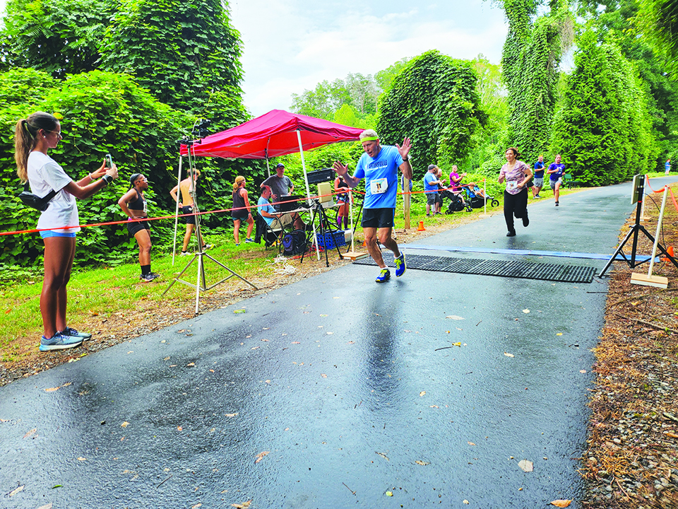 John Dyches runs the mile at age 81.