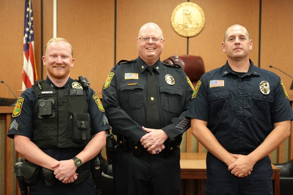 Martinsville Police Sgts. William Warnick (left) and Jason Griffith (right) are pictured with Police Chief Rob Fincher (center).