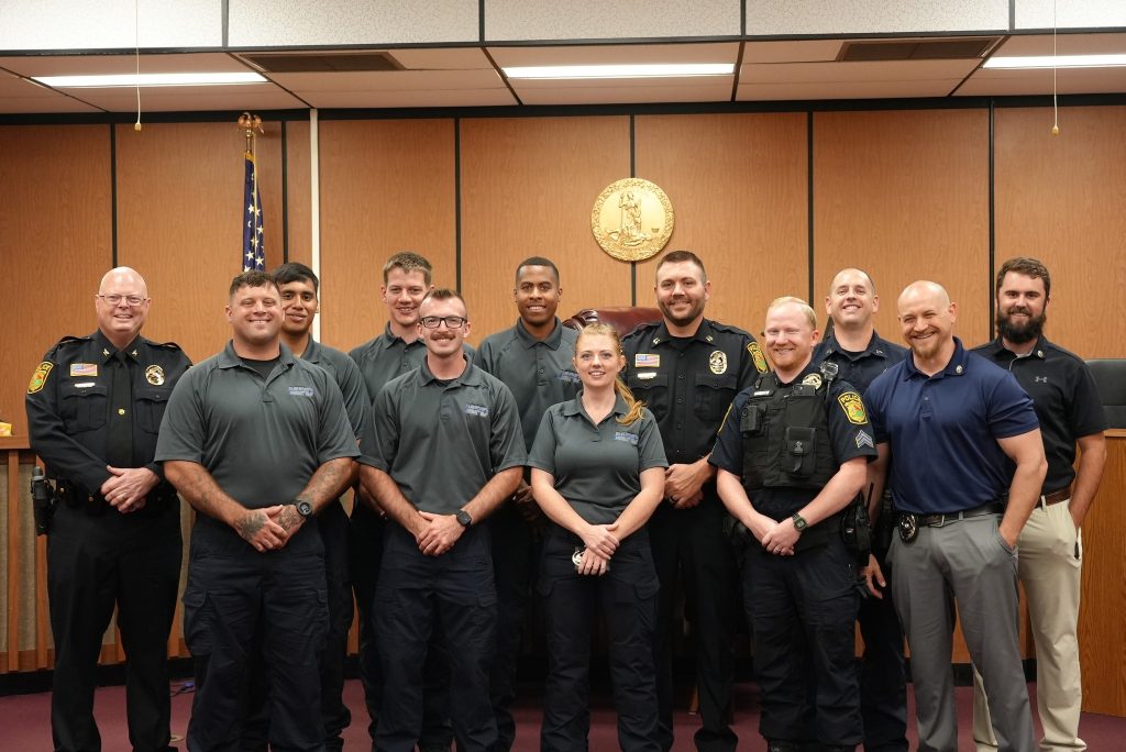 Martinsville Police Chief Rob Fincher (left) is pictured with a group of officers at a swearing in and promotions ceremony held Monday.