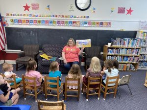 Erica Jones reads to children during Story Time at the Spencer-Penn Center.