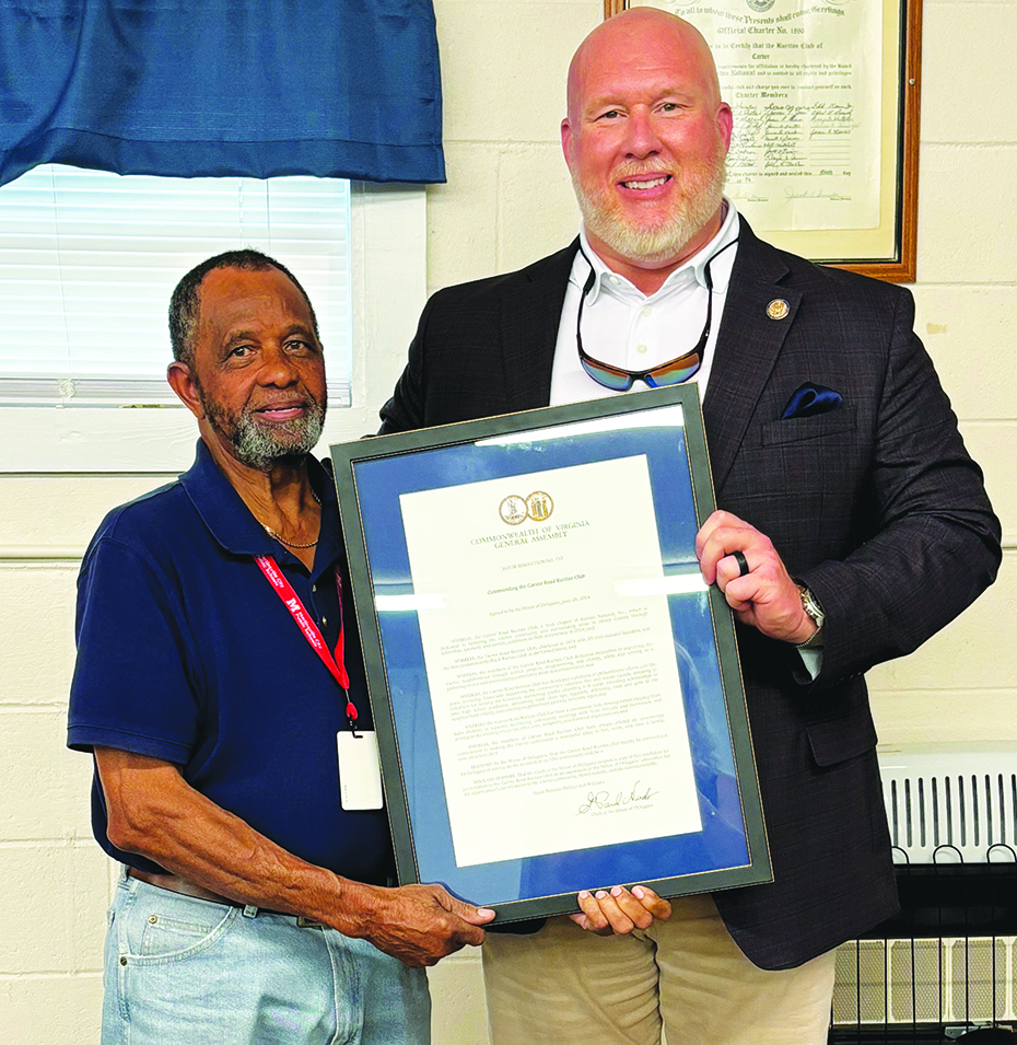 Del. Eric Phillips is pictured with members of the Carver Road Ruritan Club when presenting a resolution Monday.