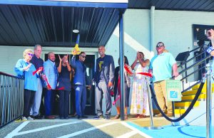 County and city officials were on hand as TAD Tavern celebrated its grand opening with a ribbon-cutting ceremony.