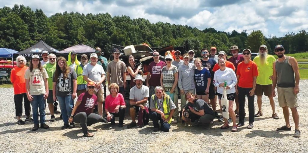 Volunteers posed with the litter they helped remove from waterways, roads and trails in Henry County and Martinsville. (Contributed by DRBA)