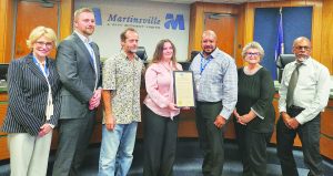 Ayla Gordon, with her father Sifu Kristian Gordon, is recognized by the council for her world championship win.