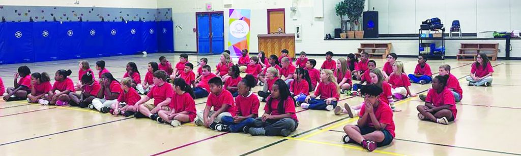 Students at Axton Elementary School wait patiently to begin their performance.