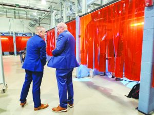 Congressman Morgan Griffith and Greg Hodges tour welding booths at P&HCC.