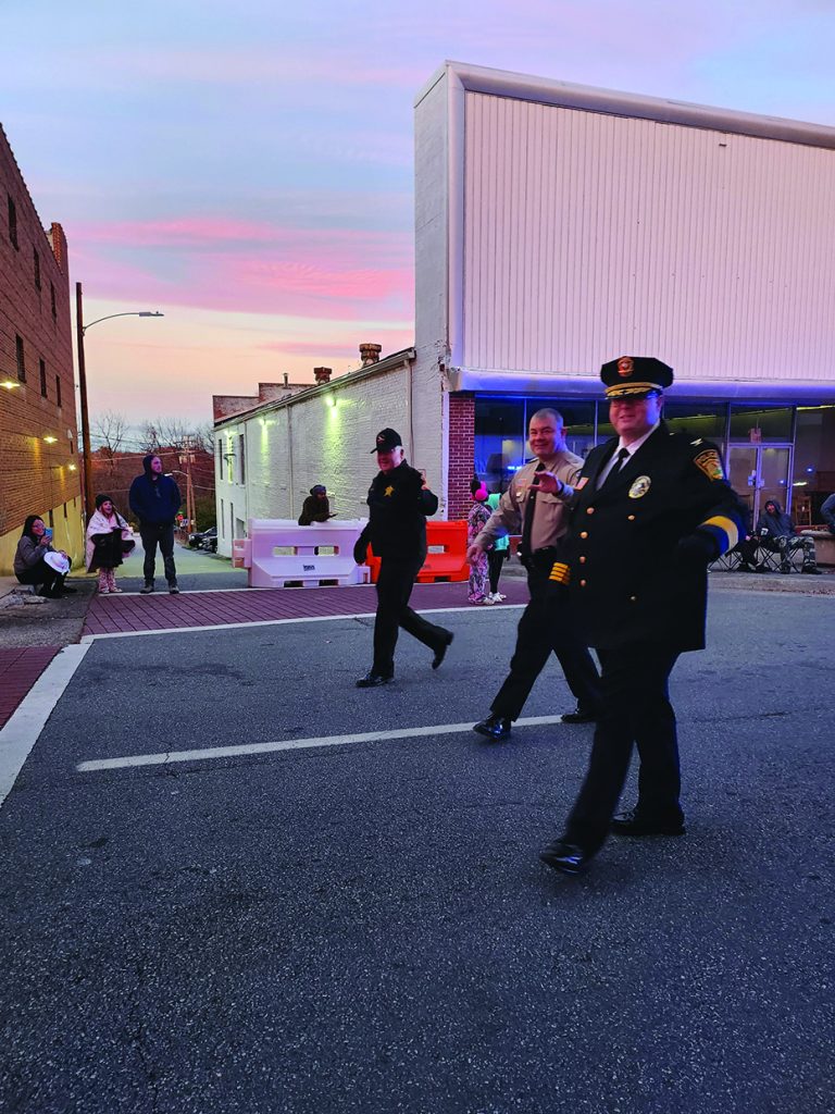 Martinsville Police Chief Rob Fincher (right to left), Henry County Sheriff Wayne Davis, and Martinsville Sheriff Steve Draper walked the parade route.