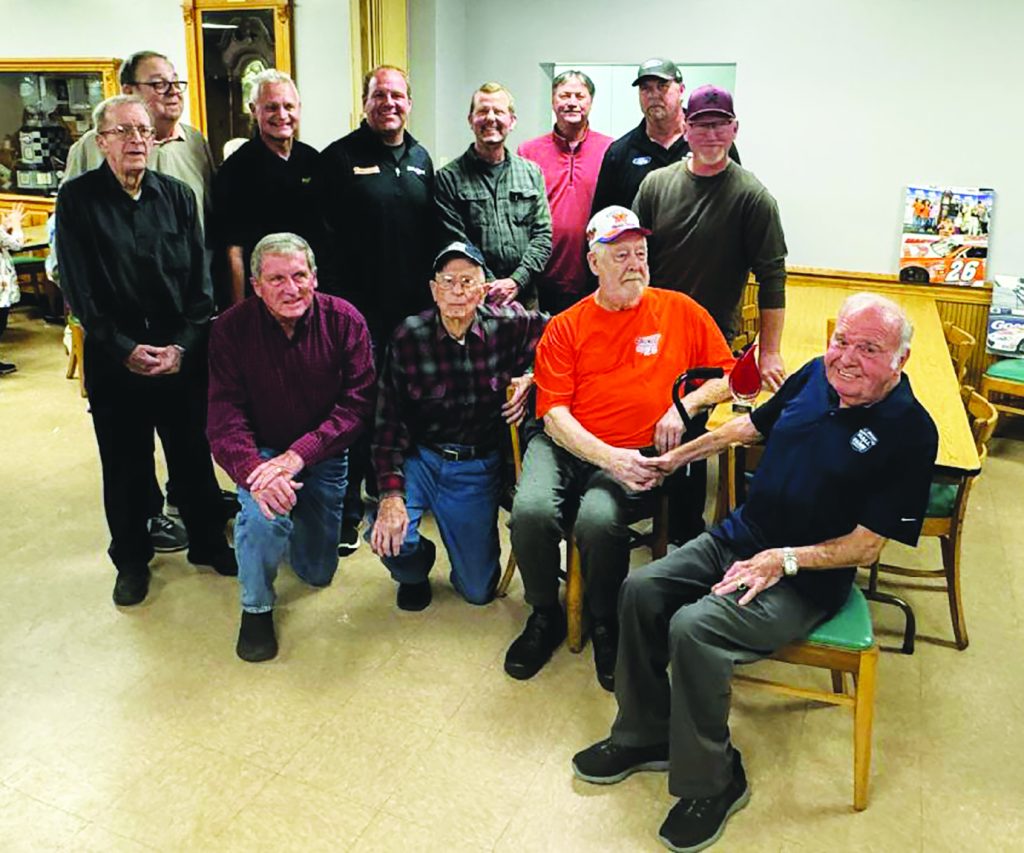Clarence Pickurel (wearing an orange shirt) is surrounded by a group of some of the biggest names in racing at a tribute held at Clarence’s Steakhouse in Ridgeway, on Monday, October 28. (Photos by Ray Reynolds)