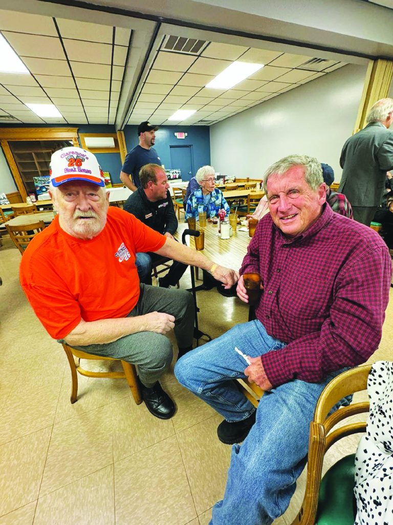 Clarence Pickurel (left), and Satch Whorley reminisce at a tribute held in Pickurel’s honor.
