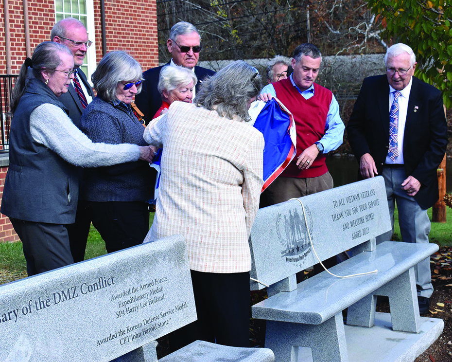 City and county officials and others attended the unveiling of the Vietnam Veteran Bench at Bassett Historical Center.