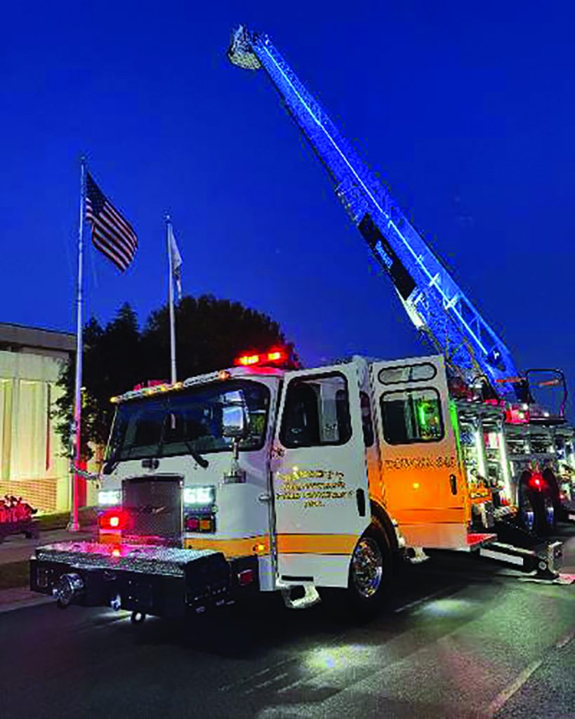 Members of the Henry County Board of Supervisors and the Bassett Volunteer Fire Department pose with the newly acquired ladder truck after the Nov. 22 meeting.