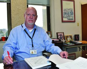 Chief Financial Officer Darrell Jones reviews a draft of Henry County’s fiscal year 2024 audit, conducted by Creedle, Jones & Associates, P.C.