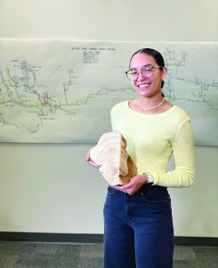 Student Bianca Maldonado-Arroyo holds the polished cave shield collected from Endless Caverns located in Virginia's Shenandoah Valley. (Contributed)