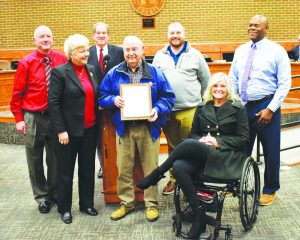 Clifford Stone, flanked by members of the Henry County Board of Supervisors, received the 2024 Jack Dalton Community Service Award for his dedication to the community.