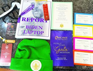 Ray Reynolds displays a collection of memorabilia he gathered during his trip to witness President Donald Trump take the oath of office