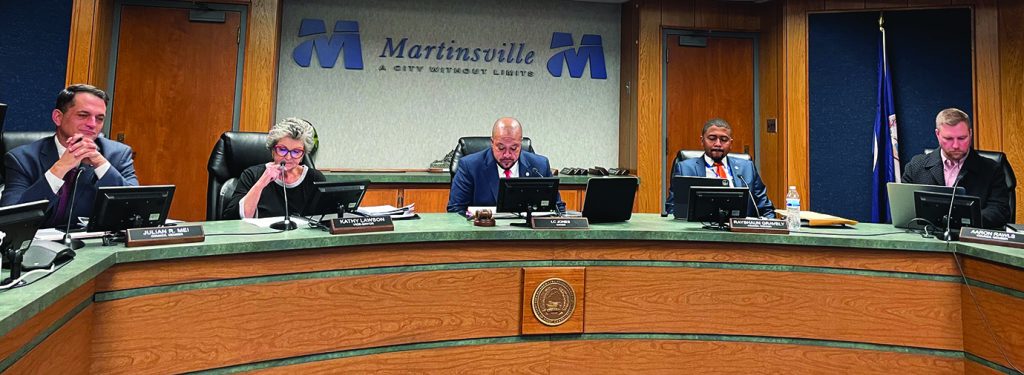 Council Members Julian Mei (far left), and Rayshaun Gravely (second from right) participated in their first regular meeting since being elected to the Martinsville City Council.